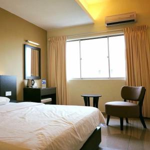 Postel nebo postele na pokoji v ubytování Villa Hotel Segamat
