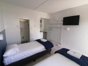 Postel nebo postele na pokoji v ubytování Hoey Moey Backpackers