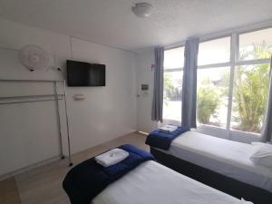 Postel nebo postele na pokoji v ubytování Hoey Moey Backpackers