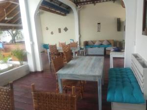 a dining room with a table and chairs at Manoha Villa in Sihanoukville