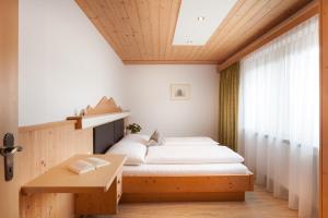 Postel nebo postele na pokoji v ubytování Haus Bstieler