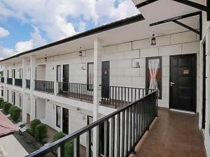 a balcony of a building with a basketball hoop on it at RedDoorz @ Wisma Pangrango in Palangkaraya