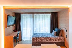 A bed or beds in a room at Hotel Rierhof