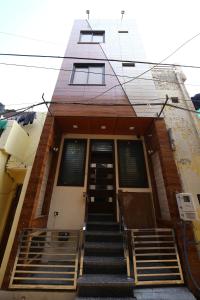 a building with stairs leading up to a door at Hotel Byke Ride in Agra