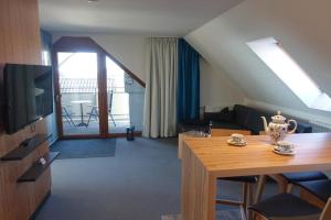TV a/nebo společenská místnost v ubytování Hotel Gasthaus Krone