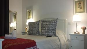 A bed or beds in a room at Casa de Huéspedes Prada