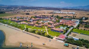 an aerial view of a resort on the beach at ROBINSON Cyprus in Alaminos