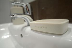Kúpeľňa v ubytovaní Apartamenty Karawela - Nadmorski Dwór