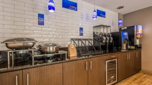 a kitchen with pots and pans on a counter at Best Western Inn Florence in Florence