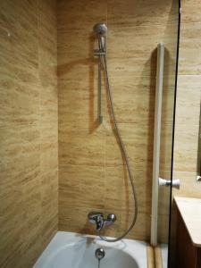 a shower in a bathroom with a sink at A Casa de Matelos in A Lanzada