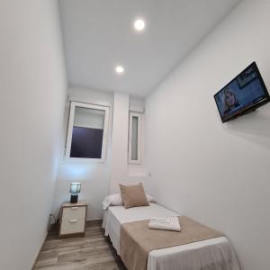 Posteľ alebo postele v izbe v ubytovaní Hostal Las Fronteras