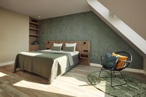 a bedroom with a bed and a chair at Farm house Van der Valk Hotel Leeuwarden in Leeuwarden