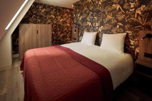 Ένα ή περισσότερα κρεβάτια σε δωμάτιο στο Farm house Van der Valk Hotel Leeuwarden