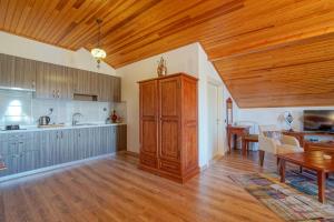 a kitchen and dining room with a wooden ceiling at My Marina Select Hotel in Datca