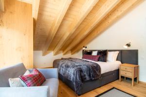 מיטה או מיטות בחדר ב-Britannia Penthouse
