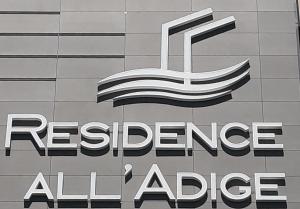 a sign for theresurancealliancealliance alliance on a building at Residence all'Adige in Verona