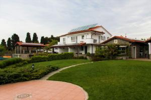 a house with a solar roof on a lawn at Debeli Rtič Apartments - Happy Rentals in Ankaran