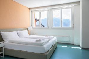 a bedroom with a bed and a window at Casa San Bernardo in Contra