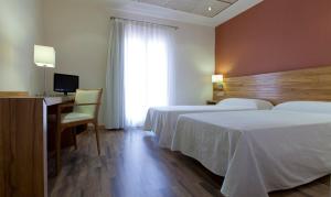 Postel nebo postele na pokoji v ubytování Hotel Bulevard + 32 fotografií