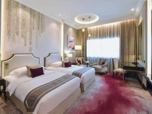 Postel nebo postele na pokoji v ubytování Mövenpick Hotel Bahrain