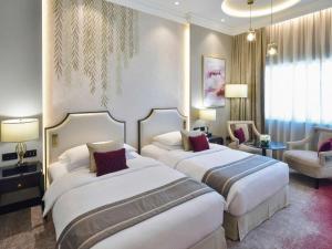 Postel nebo postele na pokoji v ubytování Mövenpick Hotel Bahrain