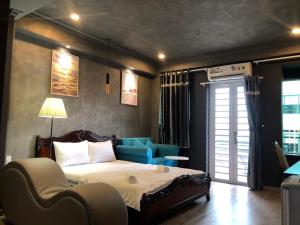 Cama o camas de una habitación en Happyhomes Saigon Central