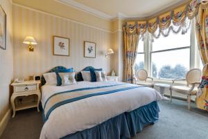 A bed or beds in a room at St Tudno Hotel 