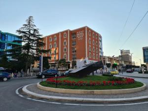 a sculpture in the middle of a city street at Hotel Liss in Lezhë