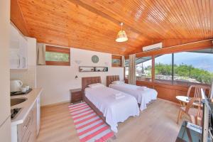 Postel nebo postele na pokoji v ubytování Villa Dundar - Kas Apartments + 37 fotografií