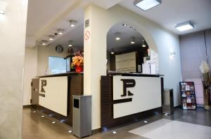 a lobby with two counters with the letter r on it at Hotel Srbija in Belgrade