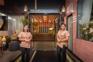 two women standing in front of a building at I-Inn Hotel in Bangkok