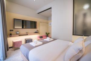 Posteľ alebo postele v izbe v ubytovaní Metis Urbane Living Spaces