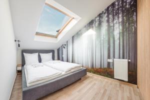 Posteľ alebo postele v izbe v ubytovaní Apartamenty Sun & Snow Seaside Grzybowo
