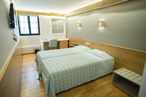 Postel nebo postele na pokoji v ubytování Byzantino Hotel