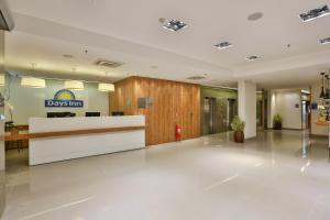 a lobby of a day inn building with a reception desk at Days Inn by Wyndham Rio de Janeiro Lapa in Rio de Janeiro +65 photos