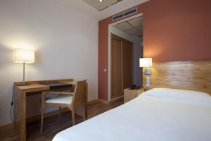 Postel nebo postele na pokoji v ubytování Hotel Bulevard