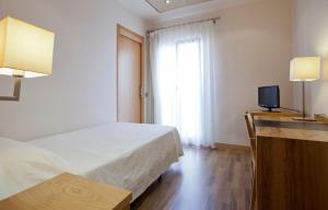 Postel nebo postele na pokoji v ubytování Hotel Bulevard