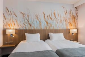 Postel nebo postele na pokoji v ubytování Holiday Inn Calais Coquelles by IHG