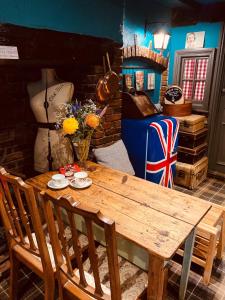 a dining room with a wooden table and chairs at Minster Walk Guesthouse in York +30 photos