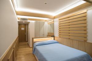 Postel nebo postele na pokoji v ubytování Byzantino Hotel
