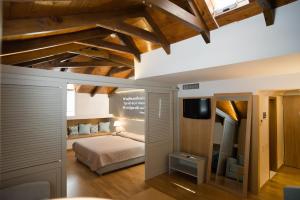 Postel nebo postele na pokoji v ubytování Byzantino Hotel