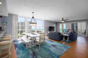 a living room with a table and chairs and a couch at Sterling Shores V in Destin