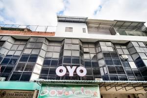 a building with an ovo sign on it at OYO 3212 Coffee Jodoh Homestay in Nagoya