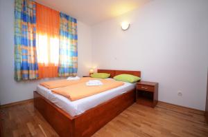 Cama o camas de una habitación en Apartments and Rooms Stipe