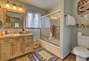 a bathroom with a toilet sink and a shower at Walk to Town Updated Frisco Cabin with 2 Decks! in Frisco +19 photos