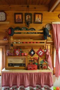 a toy room with a table with a radio on it at Ethno Cottage "Biljana" in Zlatibor