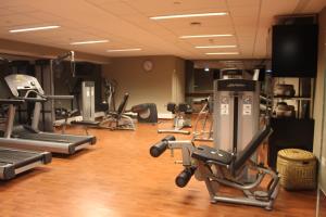 a gym with several exercise bikes and tread machines at InterContinental Cascais-Estoril by IHG in Estoril