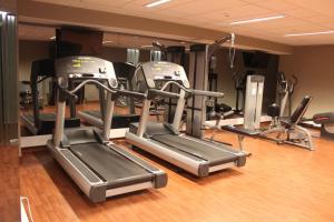 a gym with several tread machines in a room at InterContinental Cascais-Estoril by IHG in Estoril