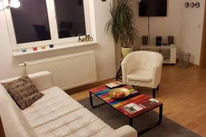 Posezení v ubytování CARLO familienfreundliches 3-Raum Apartment auf der DOM-Insel
