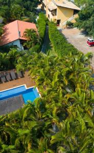 an aerial view of a resort with a pool and trees at Pousada Vila Tamarindo Eco Lodge in Florianópolis